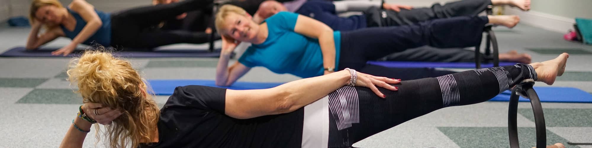 Pilates instructor taking class in Wrexham