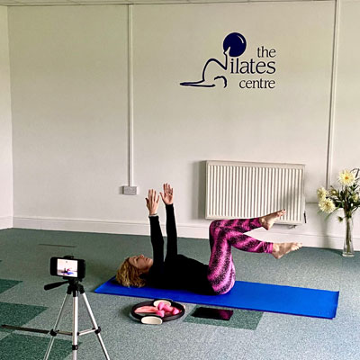 Pilates instructor filming online session